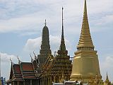 Bangkok 04 01 Wat Phra Kaeo Golden Phra Siratana Chedi, the Mondop, and the Royal Pantheon The Grand Palace was established in 1782, when King Rama I moved the capital from Thonburi to Bangkok. It is surrounded by four walls, 1900m in length. The Wat Phra Kaeo, or Temple Of The Emerald Buddha, was built inside The Grand Palace walls in 1785 by Rama I as a royal chapel. There are three monuments just as you enter Wat Phra Kaeo, a reliquary in the shape of a golden chedi, the Mondop, modeled on Ankor Wat a repository for Buddhist sacred scriptures inscribe on palm, and the Royal Pantheon in which statues of past kings of the Chakri dynasty are enshrined.